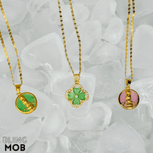 Load image into Gallery viewer, green jade necklaces, pink jade necklace, clover necklace and gold buddha necklace 
